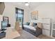 Cozy bedroom with a daybed, desk, and soft natural light at 22473 E Twilight Dr, Queen Creek, AZ 85142
