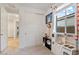Bright bedroom features playful decor, storage, and natural light by the play kitchen at 22473 E Twilight Dr, Queen Creek, AZ 85142