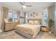 Comfortable bedroom with a queen size bed, soft decor, and ample natural light at 22473 E Twilight Dr, Queen Creek, AZ 85142