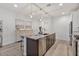 Spacious kitchen island with granite counters and a sleek design, complemented by modern decor at 22473 E Twilight Dr, Queen Creek, AZ 85142