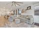 Bright living room featuring a large sectional, modern decor, and an open floor plan at 22473 E Twilight Dr, Queen Creek, AZ 85142