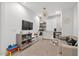 Living room with modern décor featuring a tv, shelving, and mini bar at 22473 E Twilight Dr, Queen Creek, AZ 85142