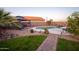 Spacious backyard with a luxurious pool, spa, and patio area, perfect for outdoor enjoyment and entertaining at 24721 W Dove Butte --, Buckeye, AZ 85326