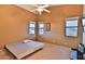 Bright bedroom with three windows, ceiling fan and neutral carpet at 24721 W Dove Butte --, Buckeye, AZ 85326