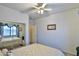 Cozy bedroom features mirrored closet doors, neutral walls, and a comfortable bed with a patterned comforter at 24721 W Dove Butte --, Buckeye, AZ 85326