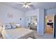 Inviting bedroom with mirrored closet reflecting bed, and doorway to a second living space at 24721 W Dove Butte --, Buckeye, AZ 85326