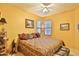 Well-lit bedroom with patterned bedspread, window view, and decorative accents for a comfortable feel at 24721 W Dove Butte --, Buckeye, AZ 85326