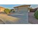 Home exterior with stone accents, desert landscaping, concrete driveway, and a two car garage at 24721 W Dove Butte --, Buckeye, AZ 85326