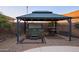 Backyard gazebo featuring a hot tub and comfortable seating, creating a perfect outdoor retreat for relaxation and entertainment at 24721 W Dove Butte --, Buckeye, AZ 85326