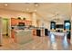 Spacious kitchen with an island, stainless steel appliances, tile backsplash, and light wood cabinets at 24721 W Dove Butte --, Buckeye, AZ 85326