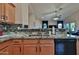 Close up on kitchen with neutral granite countertop and stainless dishwasher at 24721 W Dove Butte --, Buckeye, AZ 85326