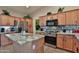 Spacious kitchen with an island, stainless steel appliances, tile backsplash, and light wood cabinets at 24721 W Dove Butte --, Buckeye, AZ 85326