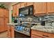 Well-equipped kitchen with granite countertops, oven and attractive backsplash at 24721 W Dove Butte --, Buckeye, AZ 85326