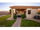 Charming covered patio with a cozy seating area, barbecue, and well-manicured landscaping at 24721 W Dove Butte --, Buckeye, AZ 85326