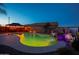 Outdoor pool boasts a waterfall feature illuminated by landscape lighting for nighttime enjoyment at 24721 W Dove Butte --, Buckeye, AZ 85326