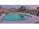 Beautiful backyard pool with a rock waterfall feature and lush landscaping creating a private oasis at 24721 W Dove Butte --, Buckeye, AZ 85326