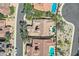 Aerial shot showcasing a neighborhood with private backyard pools, lush landscaping, and well-maintained tile roofs at 25929 N 84Th Ln, Peoria, AZ 85383