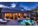Stunning backyard featuring a sparkling pool, outdoor seating, and a covered patio for entertaining at 25929 N 84Th Ln, Peoria, AZ 85383