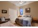 Cozy bedroom with neutral tones, ample natural light, and closet space at 25929 N 84Th Ln, Peoria, AZ 85383