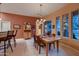 Elegant dining room with a wooden table, comfortable chairs, and natural light at 25929 N 84Th Ln, Peoria, AZ 85383