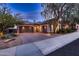 Attractive home featuring a three-car garage, brick driveway, neutral stucco, and manicured landscaping at 25929 N 84Th Ln, Peoria, AZ 85383