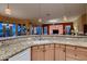 Bright kitchen with granite countertops, custom cabinets, and an open layout at 25929 N 84Th Ln, Peoria, AZ 85383