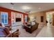 Stylish living room with built-in shelving, comfortable seating, and a view to the exterior at 25929 N 84Th Ln, Peoria, AZ 85383