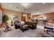 Cozy living room featuring a sectional sofa, neutral carpet, and stylish decor at 25929 N 84Th Ln, Peoria, AZ 85383
