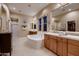 Luxurious bathroom showcasing double sinks, a soaking tub, and a separate shower area at 25929 N 84Th Ln, Peoria, AZ 85383