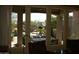 Comfortable patio view showcasing a fireplace, dining table and chairs for outdoor enjoyment at 25929 N 84Th Ln, Peoria, AZ 85383