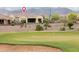 Backyard view of the home from the golf course, showcasing the serene surroundings and outdoor living at 26190 W Siesta Ln, Buckeye, AZ 85396