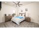 Inviting bedroom with a ceiling fan and gray patterned rug at 26190 W Siesta Ln, Buckeye, AZ 85396