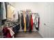 Well-organized walk-in closet with ample hanging space and shelving at 26190 W Siesta Ln, Buckeye, AZ 85396