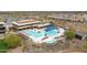 Resort-style community pool featuring lap lanes, lounge areas, and a splash pad, perfect for relaxation and recreation at 26190 W Siesta Ln, Buckeye, AZ 85396