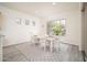 Dining room with large windows providing natural light and views of the outdoors at 26190 W Siesta Ln, Buckeye, AZ 85396
