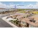 Charming single-story home featuring a desert-landscaped front yard and a tile roof, near the Saguaro Recreation Center at 26190 W Siesta Ln, Buckeye, AZ 85396