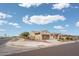 Exterior shot of the home from the street, showcasing the landscaping and neighborhood at 26190 W Siesta Ln, Buckeye, AZ 85396