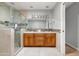 Well-lit bathroom featuring glass walk-in shower and wood cabinetry with double sinks at 2710 E Cinnabar Ave, Phoenix, AZ 85028