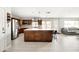 Spacious kitchen with stainless steel appliances, center island, and stylish light fixtures at 2710 E Cinnabar Ave, Phoenix, AZ 85028
