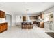 Modern kitchen with large island, stainless steel appliances, and wood cabinets at 2710 E Cinnabar Ave, Phoenix, AZ 85028