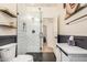 Stylish bathroom boasts herringbone shower tile and modern gold fixtures at 2732 E Hillery Dr, Phoenix, AZ 85032