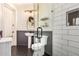 Modern bathroom featuring black herringbone floors, white subway tile and a glass shower at 2732 E Hillery Dr, Phoenix, AZ 85032