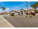 Charming single-story home featuring mature trees, desert landscaping and a three car garage at 2732 E Hillery Dr, Phoenix, AZ 85032