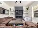 Cozy living room with a brown couch, fireplace and mounted TV at 2732 E Hillery Dr, Phoenix, AZ 85032