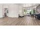 Spacious living room with modern lighting, wood floors, and bright neutral walls at 2732 E Hillery Dr, Phoenix, AZ 85032
