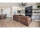 Living room with fireplace, mounted TV, and comfortable seating at 2732 E Hillery Dr, Phoenix, AZ 85032