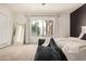 Bright main bedroom with modern furnishings and outdoor views at 2732 E Hillery Dr, Phoenix, AZ 85032