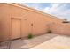 Private backyard featuring stone tile, a block wall, and tiki torches creating a serene outdoor retreat at 2875 W Highland St # 1152, Chandler, AZ 85224