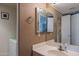 The bathroom has a single sink vanity, white cabinets and mirror at 2875 W Highland St # 1152, Chandler, AZ 85224