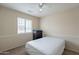 Neutral bedroom featuring a window, ceiling fan and neutral carpeting at 2875 W Highland St # 1152, Chandler, AZ 85224